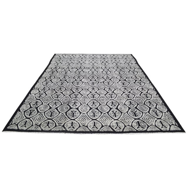Hand-knotted with care using traditional rug-making techniques, this wool rug blends timeless craftsmanship with a modern...