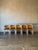 This set of ten stacking chairs features bent tubular frames and curved wooden backrests. Their lightweight space-saving...