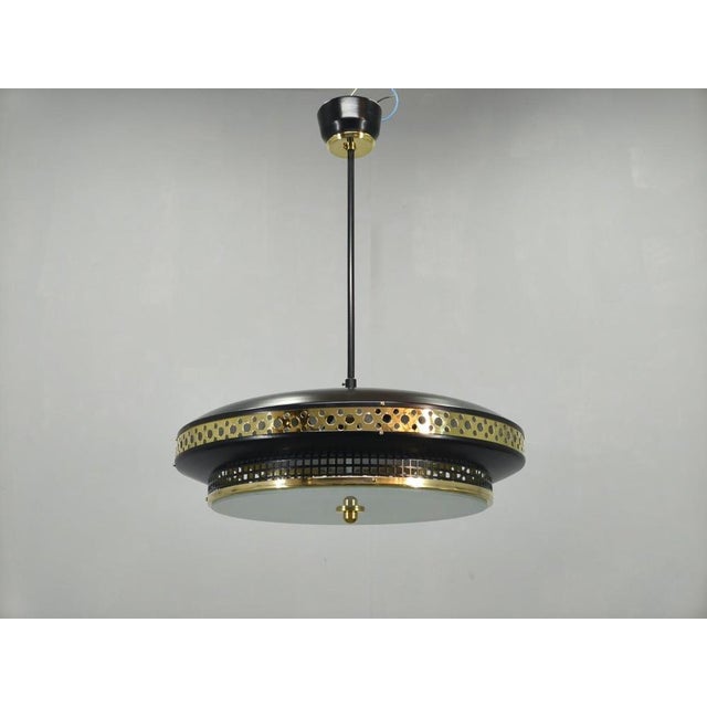 Mid-century modern “ufo” chandelier produced by ludib bratislava in czechoslovakia during the 1960s. This architectural...