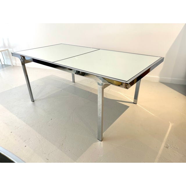Chrome-plated steel, expandable table by Pierre Cardin for Dillingham Furniture Co. with three new, mirrored glass tops....