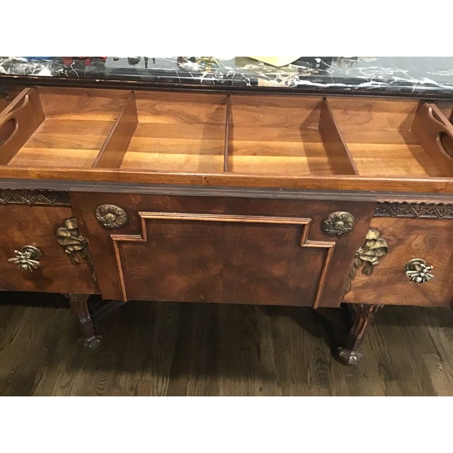 Timeless old world elegence and exquiste woodwork . two spacious central draws ideal for silverware,linens and serving...