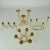 Group of four brass candelabras with organic curves. One for six regular candles, two for three regular candles and one...