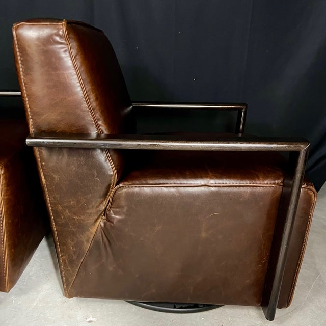 Very stylish Italian pair of swivel leather club chairs having cube form with great comfort and style reminiscent Roche...
