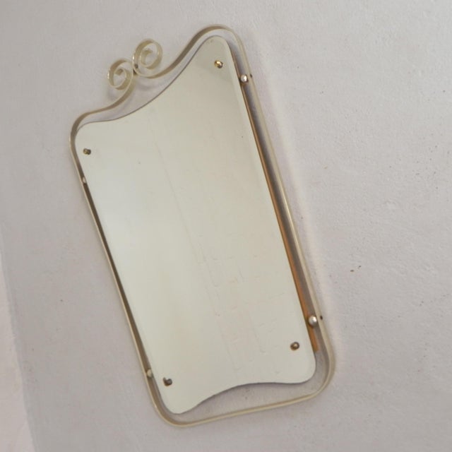 Height: 74 cm. Width: 45 cm. Depth: 3 cm. Mirror glass dimensions: 41 x 62 cm. Origin: Belgium, 1950s. Material:...