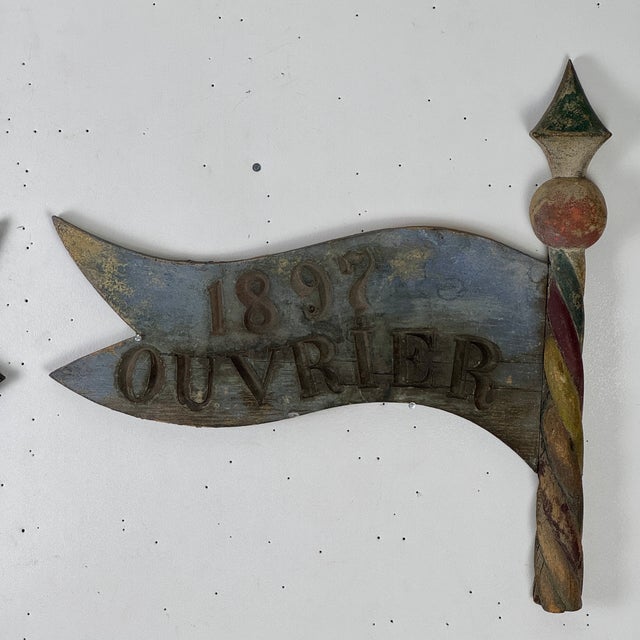 A rare pair of antique French wood trade sign. The unique hand carved and painted pieces are in the form of a pole with a...