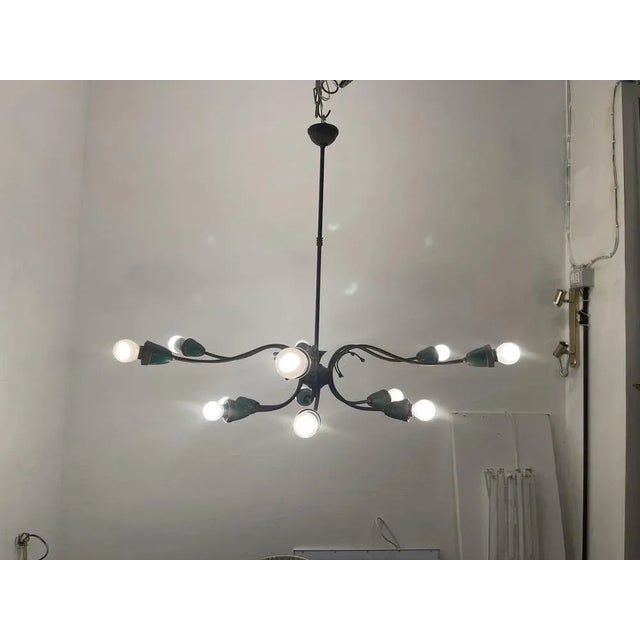Bronze green sputnik chandelier 1950’s features 12 lights requires e14 light bulbs height 67 cm width 76 cm depth 76 cm...