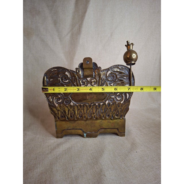 This is an exceptional, highly rare 19th-century Eastern European bench-type Hanukkah oil lamp, boasting an exquisite...