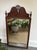 Antique Federal Style tall wall mirror flanked by a pair of traditional turned-wood finials and a carved openwork design....