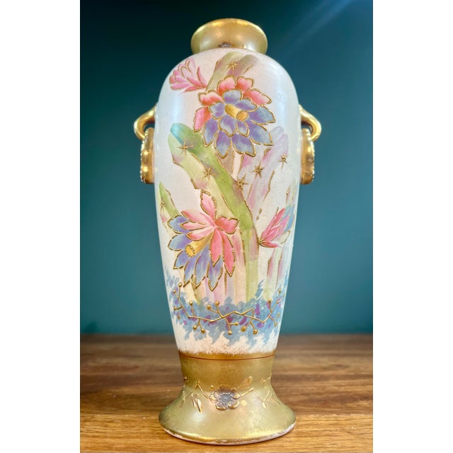 Antique hand-painted porcelain vase marked Royal Bonn. Dual handles with colors of cream and green depicting cactus...