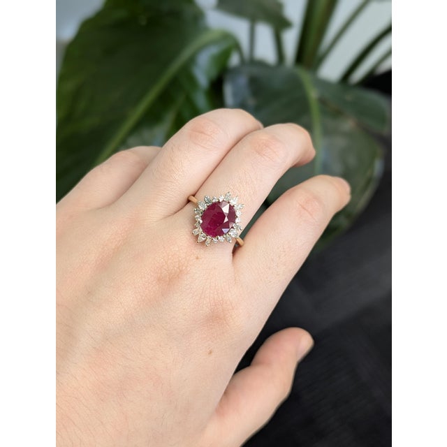 A masterpiece of fine craftsmanship, this 3.12 carat Burma ruby heirloom ring showcases a vibrant 10x8mm oval ruby...