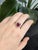 A masterpiece of fine craftsmanship, this 3.12 carat Burma ruby heirloom ring showcases a vibrant 10x8mm oval ruby...