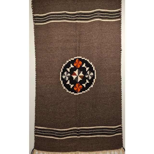Elevate your home with the rich heritage of this vintage Mexican Serape kilim rug blanket, handwoven in the third quarter...