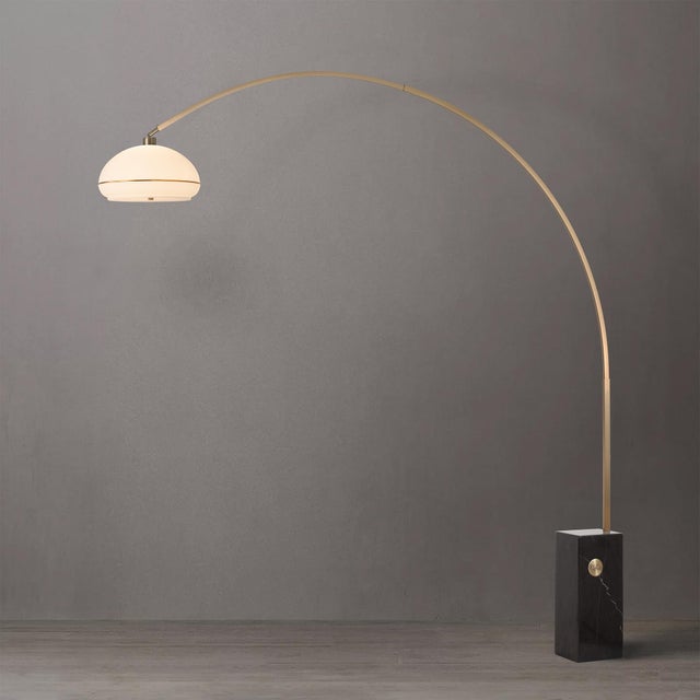Featuring a sweeping cantilever form, the Iconic Arc Lamp is a Mid-Century Modern masterpiece with a weathered brass steel...