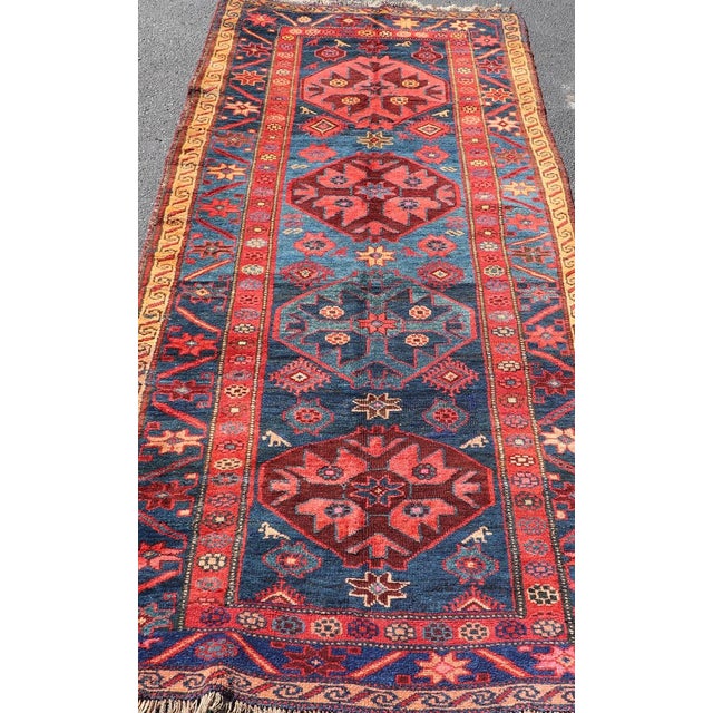 Early 20th Century Antique Kurdish Gallery Rug With Indigo Field and Bold Tribal Medallions For Sale - Image 5 of 12