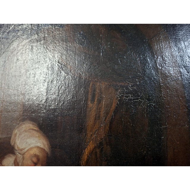 Oil on canvas – Genre scene, 18th century A charming 18th-century oil on canvas depicting an interior scene inspired by...