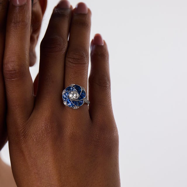 This captivating Art Deco style ring is a bold contemporary design inspired by the symmetry, color, and architectural...