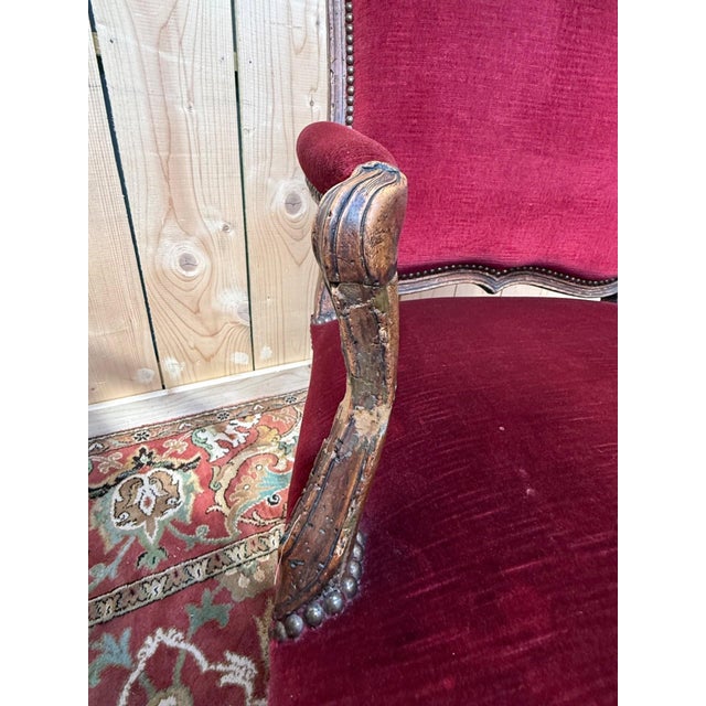 Pair of Louis XV period armchairs in carved natural wood, exhibiting all the formal characteristics of the style: cabriole...