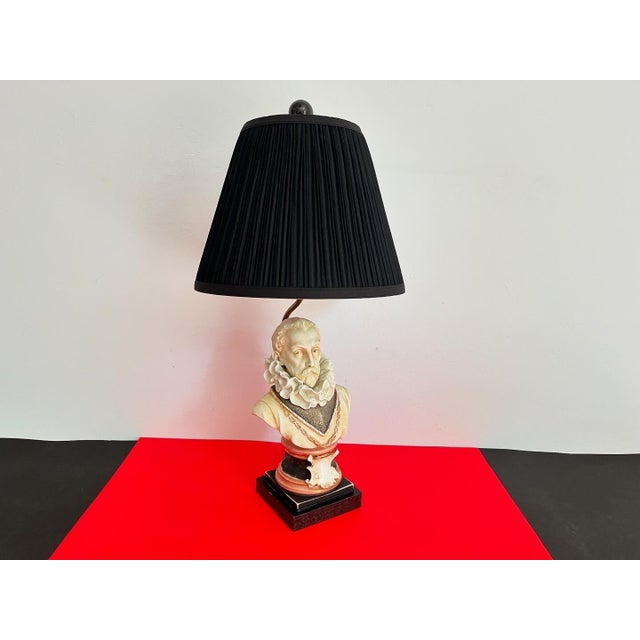 Incredible Italian porcelain bust lamp of Sir Walter Raleigh hand painted in soft shades of black, gold and coral with...