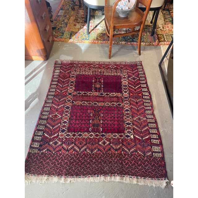 A Tekke Turkmen ensi (or engsi) is a hand-knotted tribal rug traditionally woven as a decorative and ceremonial door...