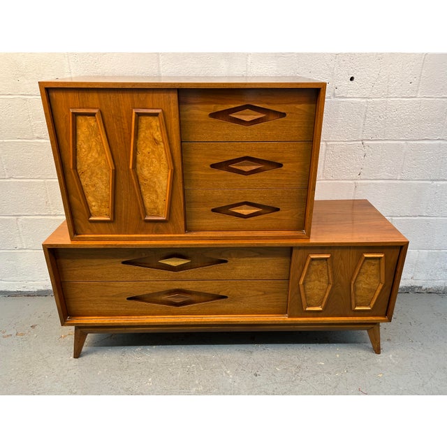 Exceptional mid-century modern two-piece dresser set, crafted in rich walnut and featuring distinctive burl wood drawer...
