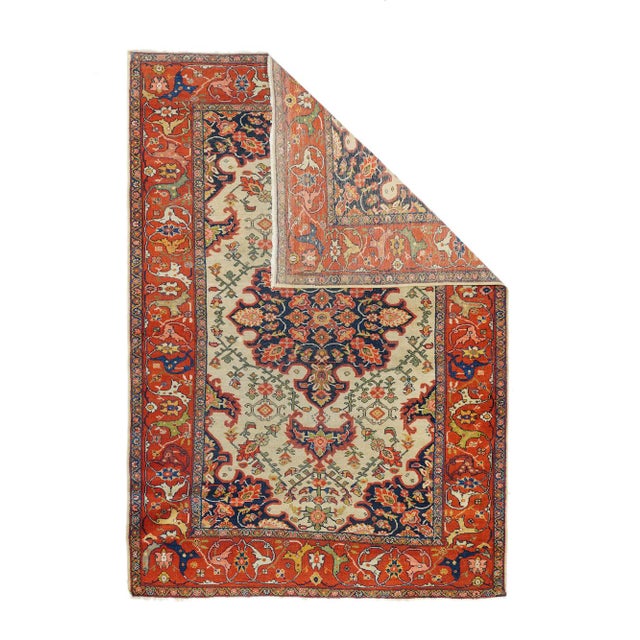The well-woven village carpets from the Arak/Sultanabad area, especially the red field/navy border, detached floral spray...