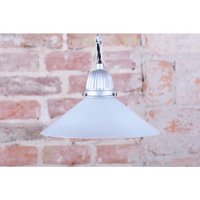 This pendant chandelier, originating from the 1970s Czechoslovak design environment, represents a typical example of the...