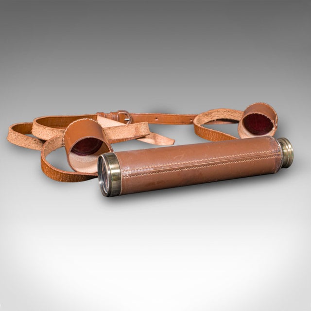 This is a vintage 3-draw telescope. An English, leather and brass navigational or astronomical instrument, dating to the...