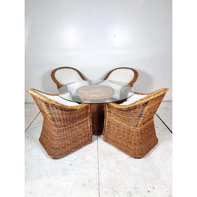 Vintage braided wicker dining set. Wicker Works style thick woven wicker/rattan with braided trim. Upholstered seats....