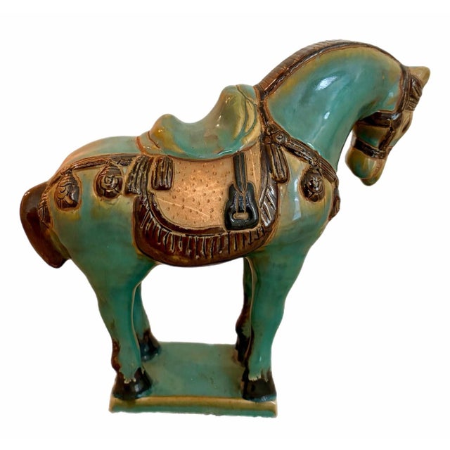 A horse figurine that makes a beautiful presentation and statement. Painted and carved with a gloss finish. Date for this...