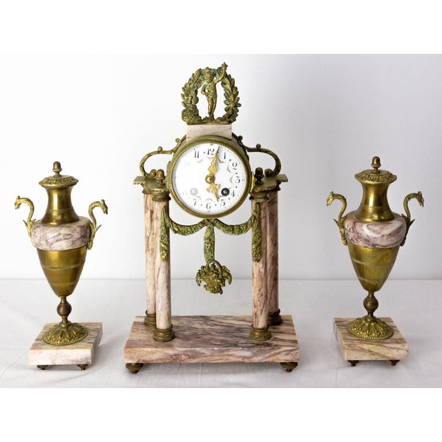 Napoleon iii french gilded bronze mantel clock with putti cherub on the top of the clock late 19th century circa 1890. Set...