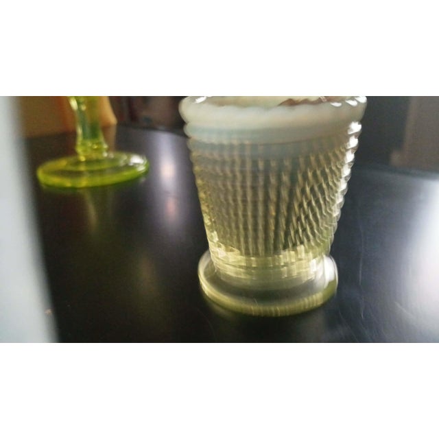 A beautiful antique ribbed uranium (Vaseline) glass toothpick holder with a classic Victorian-era design. This petite...