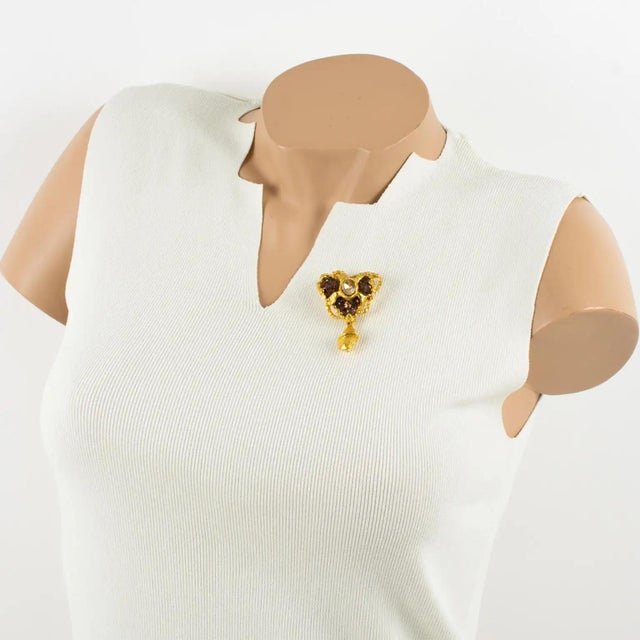 This stunning Christian Lacroix Paris brooch features a Baroque heart shape with a dangling charm. The gilded metal...