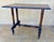 Elegant 20th century side table featuring a beautifully turned-leg base and original castors, typical of late Victorian...