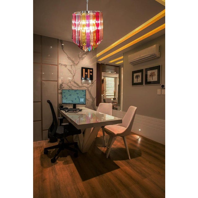 Fantastic vintage murano chandelier made by 47 murano multicolored crystal prism "quadriedri" in a nickel metal frame. The...