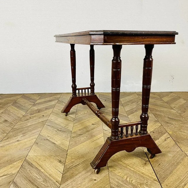 A Beautiful Antique Side or Console Table. circa 1880s Made from mahogany and sitting on original castors, the table has...
