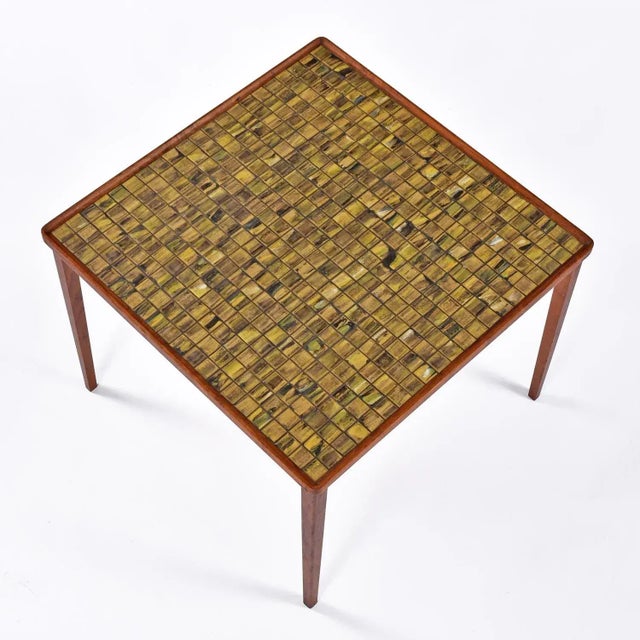 We’ve never seen a tile top Danish teak cocktail table with this captivating tile design. Each tile is a completely...