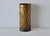 A vintage mid-century Italian-style hammered, textured umbrella stand featuring a twisted body. The stand is constructed...