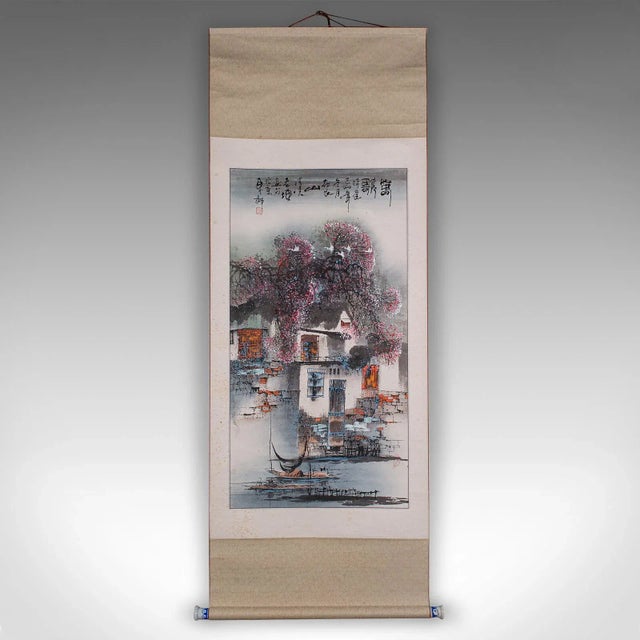 This is a tall contemporary scroll ink painting. A Chinese, silk cotton and ceramic rolling wall panel, dating to the late...