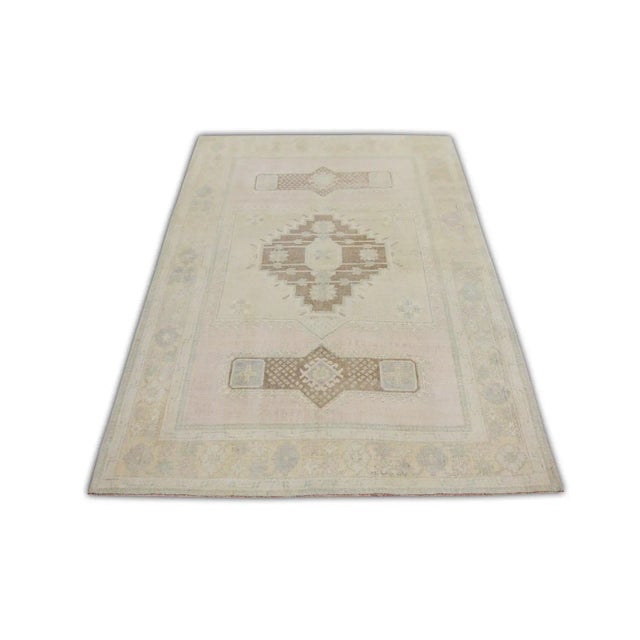 This exquisite Vintage Turkish Anatolian rug is a masterful example of traditional hand-knotted craftsmanship. Measuring...