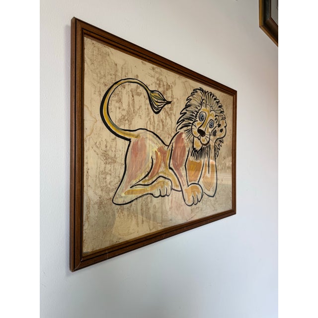 Playful and full of character, this vintage painting by R. Horwitz depicts a reclining lion with bold black outlines, warm...