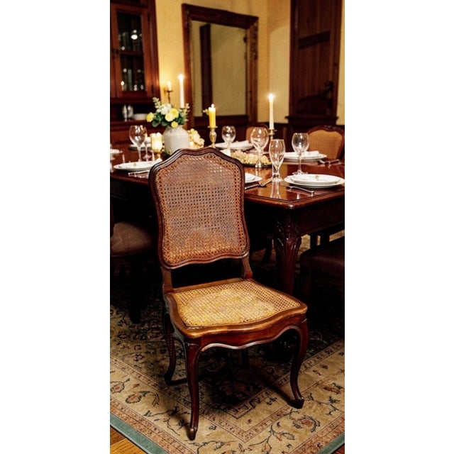 Elegant and timeless, these chairs feature shaped crest rails, graceful cabriole legs, and handwoven cane panels...