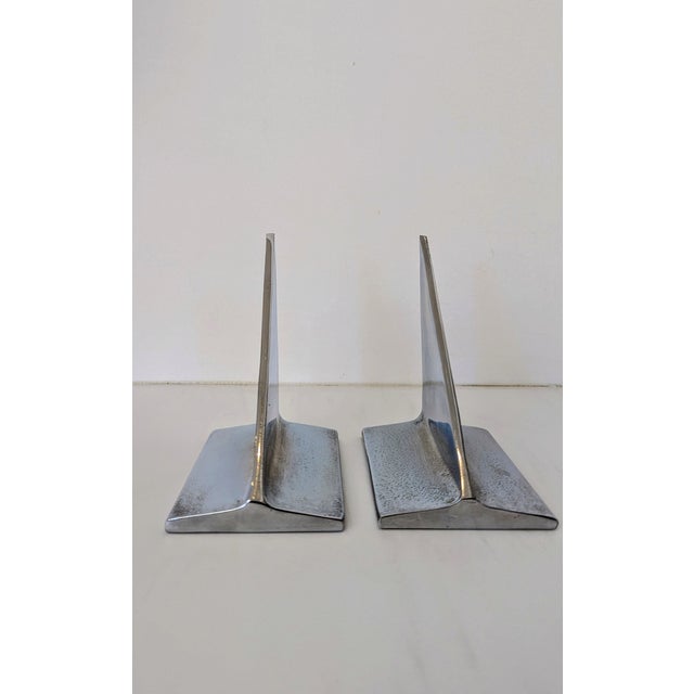 Mid-Century Chrome Sailboat Bookends | Minimalist Nautical Design A striking pair of vintage bookends featuring polished...