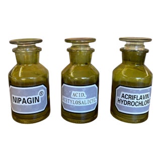 Set of 3 Vintage Olive Green Toned Glass Apothecary Bottles With Glass Stoppers and Pharmacy Labels. For Sale