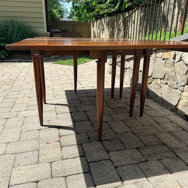 Vintage Willett Solid Cherry Transitional Drop Leaf Dining Table A versatile drop leaf dining table made even more so with...