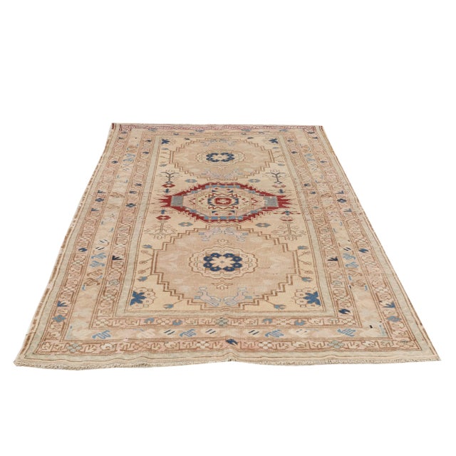 Vintage handknotted washed out Caucasian wool rug. Approximately 60-70 years old. In very good condition.