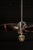 Early 20th-century salvaged ship propeller mold repurposed as a dramatic ceiling-mounted pendant light. Originally created...