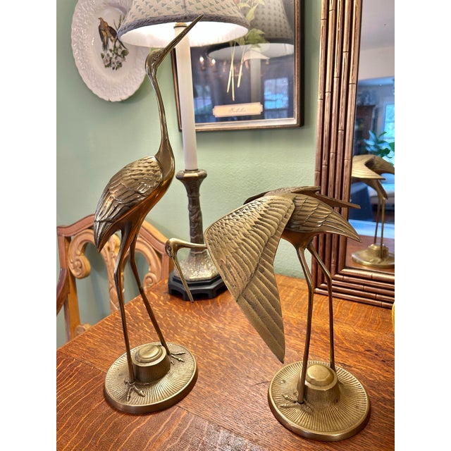 This is a pair of the beloved and sought after brass crane sculptures from the mid century. These are larger than most ,...