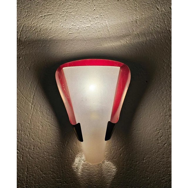 In this listing you will find a pair of striking and very elegant Mid Century Modern sconces attr. to Stilnovo done in...