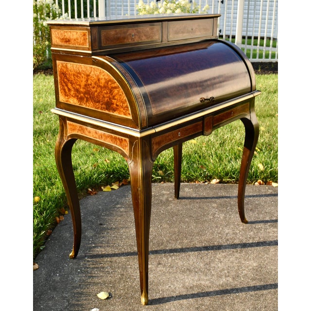 Antique (1890's) Cylinder Roll Top Desk has a French Louis XV Style. The Wood is Walnut and Burl Wood. Inlaid. Fitted...
