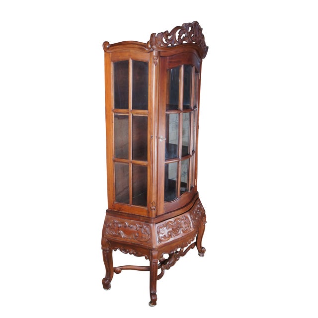 Late 20th - early 21st century curio cabinet. A modern take on a timeless Victorian design. Made from mahogany with an...